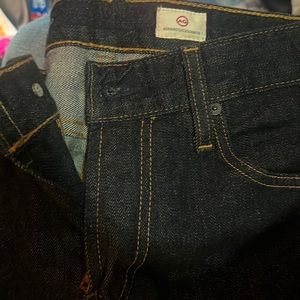 BRAND NEW - NEVER WORN - AG Nomad dark rinse jeans.